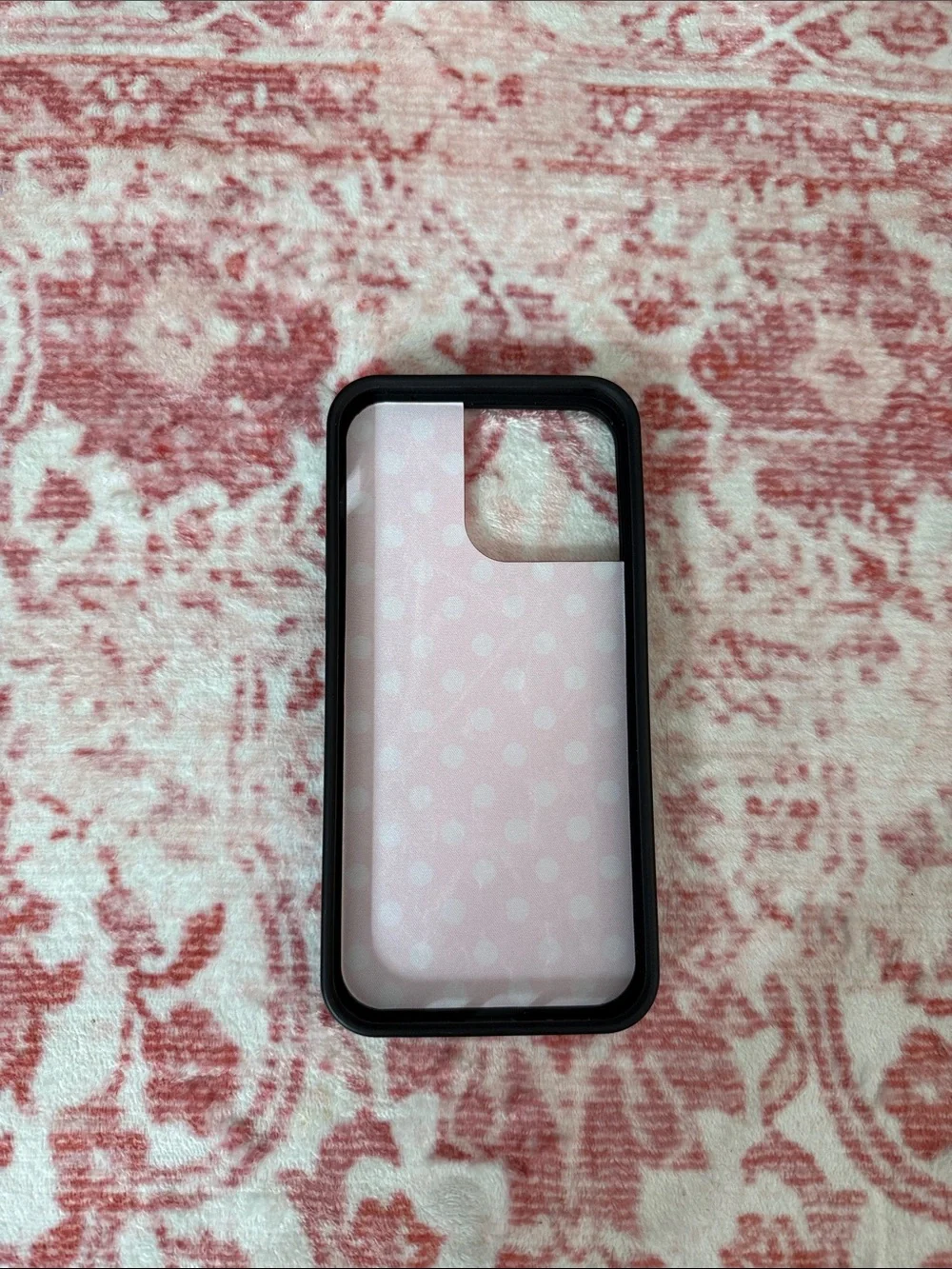 Wildflower iPhone case featuring a classic pink and white polka dot design.